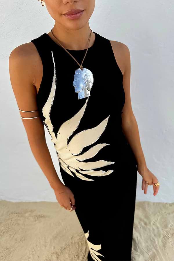 Black Sol Tank Top with a cream hand-painted sun print on the side, featuring a high neck and sleeveless fit.