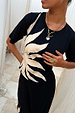 Black Sol Rib T-Shirt in a ribbed fabric featuring a cream hand-painted sun print and short sleeves.
