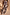 Thumbnail for Chocolate Soleil Ellie Trousers featuring a brown sun motif print and wide leg, styled as a co-ord with a matching top.
