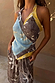 Brown Soleil Wrap Top with sun motifs and blue and yellow accents in a multi-wear handkerchief silhouette.