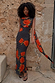Black Poppy Sophie Dress with polka dots, orange poppies, cowl neckline and matching multi-wear scarf detail.