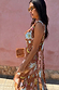 Brown Star Fawn Sophie Dress with sun and star motifs, featuring a draped front and detachable scarf.