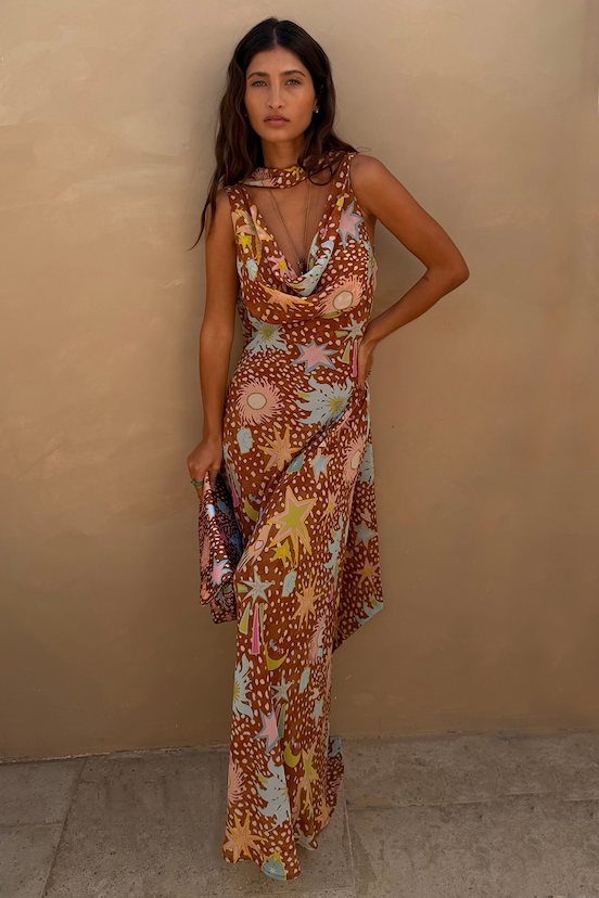 Star Fawn Sophie Dress in brown with sun motifs, featuring a draped neck and matching detachable scarf.