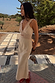 Stone Mimi Dress in cream linen with lace trim and cut-out details on a model.