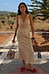 Stone Mimi Dress in cream linen with lace trim and cut-out detail, styled for a vacation.