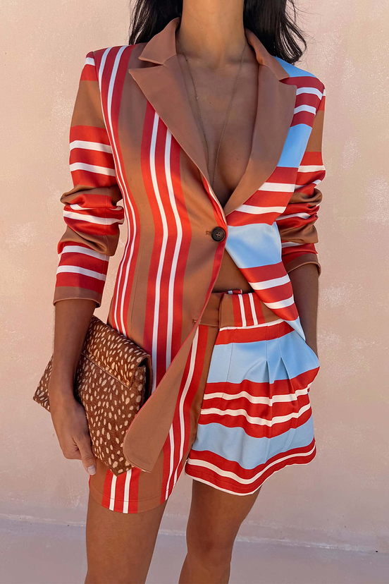 Multi Stripe Blazer in red and blue satin-esque fabric, styled as a co-ord with a leopard print clutch bag.