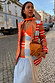 Longline Multi Stripe Blazer with red and blue stripes in a soft satin-touch fabric, styled on a cobbled street.