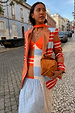 Longline Multi Stripe Blazer with red and blue stripes in a soft satin-touch fabric, styled on a cobbled street.