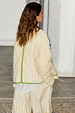 Butter Yellow Stripe Quilted Jacket featuring green trim, shown from the back with matching striped trousers.