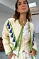 Butter Yellow Stripe Quilted Jacket with green trim and blue tassels, worn over a matching top and white shirt.
