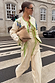 Butter Yellow Stripe Quilted Jacket with green trim and blue tassels, styled as a co-ord on a zebra crossing.