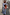 Thumbnail for Blue cotton stripe jogger with red pinstripes and matching shirt, styled with a grey sweater and leopard print shoes.