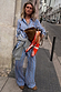 Blue cotton stripe jogger with red pinstripes and matching shirt, styled with a grey sweater and leopard print shoes.