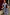 Thumbnail for Blue Cotton Stripe Jogger with red pinstripes, paired with a matching shirt and grey sweater tied at the waist.