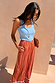 Multi Stripe Marnie Trousers in a satin-esque wide leg fit with bold stripes, styled with a light blue vest.