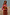 Thumbnail for Multi Stripe Tank Top in tan and red knit, layered over a striped shirt with a bow and matching striped trousers.
