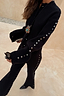 Thumbnail for Black Studded Cardigan with silver sleeve studs, paired with matching knit trousers for a textured co-ord look.