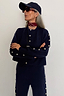 Thumbnail for Navy Blue Studded Cardigan with silver stud detailing, styled as a knit co-ord for a London look.