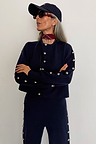 Navy Blue Studded Cardigan with silver stud detailing, styled as a knit co-ord for a London look.