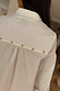 White Marley Shirt back detail featuring gold studs along the yoke and an embroidered logo on crisp cotton.