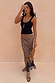 Black Studded Rib Vest featuring gold neckline detailing, styled with a leopard print lace-trimmed skirt.