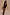 Thumbnail for Black Studded Rib Vest with gold stud detailing at the neckline, styled with a leopard print midi skirt.
