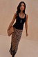 Black Studded Rib Vest with gold stud detailing at the neckline, styled with a leopard print midi skirt.