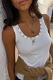 White Studded Rib Vest featuring gold stud neckline detailing and a ribbed texture, styled with gold necklaces.