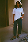 Thumbnail for White cotton T-shirt with silver stud detailing at the neckline and a relaxed fit, styled with denim jeans.