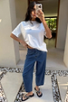 Blue Studded Barrel Jeans with side studs and a structured silhouette, styled with a white t-shirt.