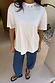 Thumbnail for White Studded T-Shirt in cotton with silver neckline detailing and a relaxed fit, styled with denim.