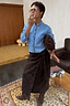 NFD Chocolate Suede Jaspre wrap midi skirt styled with a blue cardigan and brown suede boots.