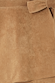 Iconic Tan Suede Mini Jaspre Skirt close-up highlighting the wrap waist tie and texture.