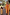 Thumbnail for Girl's yellow cotton maxi sun dress with an orange sun print and shirred top, walking with a matching adult on vacation.