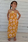NFD Kids Yellow Cotton Sun Dress featuring a sunburst print, shirred top and floaty maxi skirt.