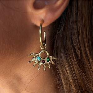 Deloris Sun Hoop Earrings in gold-tone brass featuring a sun motif and semi-precious stones, shown on a model.