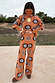 Thumbnail for Tan Sun Trousers with sun motifs in stretch knit, styled as a co-ord on a 5ft4 model wearing size M.