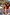 Thumbnail for Yellow Sun Swim Shorts and matching sun-print trousers on children in a sandy beach vacation setting.