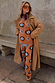 Tan Sun Copenhagen Jumper with hand-painted sun motifs, styled as a co-ord under a tan trench coat.