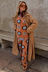 Tan Sun Copenhagen Jumper with hand-painted sun motifs, styled as a co-ord under a tan trench coat.