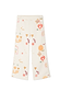 Thumbnail for Cream Sundazed Wide Leg Accessible Joggers featuring an iconic motif print and adjustable side zips.