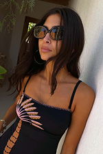 Black Studded Acetate Sunglasses with silver stud detailing, worn with a black palm tree swimsuit.