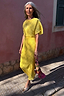 Sunshine Tilly midaxi dress in yellow plissé with gold flecks, styled for wedding guest season.