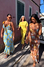 Sunshine Tilly Dress in yellow plisse with gold flecks, worn by models of various ages and sizes for inclusive fashion.