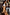 Thumbnail for Tan trench coat featuring gold studs on the sleeves, styled as a statement staple for a London street look.
