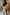Thumbnail for Tan Trench Coat with gold stud sleeve detailing and belted back, styled with a leopard print bag.