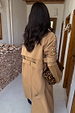 Tan Trench Coat with gold stud sleeve detailing and belted back, styled with a leopard print bag.