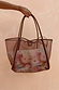 Tan Mesh Tote Bag featuring leather straps and an abstract soleil printed pouch, held against a textured wall.