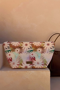 Detachable zip pouch in an abstract soleil print, featuring pink and green floral patterns with a branded logo patch.