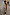 Thumbnail for Tan Trench Coat with Gold Studs and pinstripe lining, a statement staple designed in London on a 5ft5” model.